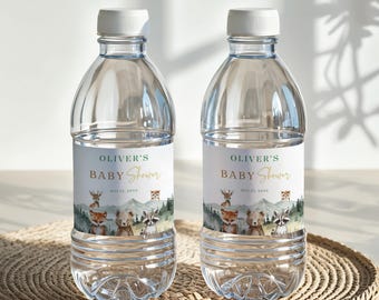 May include: Two clear plastic water bottles with white caps. Each bottle has a label that reads "Oliver's Baby Shower" with woodland animal illustrations. The labels have a green and gold colour scheme.