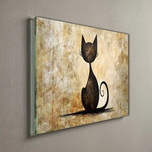 May include: A framed artwork featuring a stylized black cat silhouette against a textured, sepia-toned background. The cat is depicted in a seated pose with a curled tail. The artwork is encased in a clear glass frame, adding a modern touch to the piece.