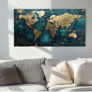 May include: A rectangular world map artwork with gold continents set against a teal and dark blue textured backdrop. The piece is displayed above a grey sofa with white cushions. The artwork is a decorative piece.