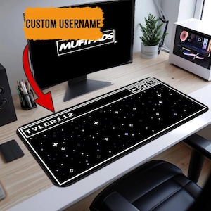 May include: Black rectangular mousepad with a white border and a starry design. The mousepad has the text "TYLER112" and a retro computer window design. The brand name "MUFIPADS" is displayed on the computer screen.