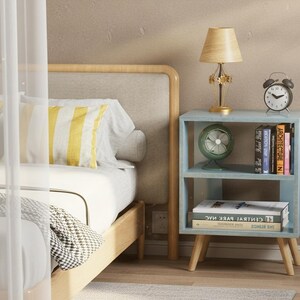 Modern nightstand beside bed with lamp and books, compact bedside table for small bedroom