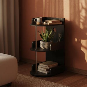 May include: A black, three-tiered corner shelf with a mug, books, and a potted snake plant. The shelf has a rounded design and is supported by a metal pole. The background is a warm-toned wall with shadows.