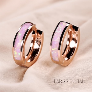 May include: A white ceramic mug with a black handle and the text "But First, Coffee" in a handwritten style. The mug is on a white surface. The mug is 10 cm tall.