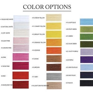 May include: A color chart titled COLOR OPTIONS displaying twenty-seven numbered swatches of thread. Colors include bleached white, natural white, off-white, light pink, sakura pink, pink, rose pink, red, burgundy, cream, yellow, orange, khaki, brown, grey, blue, and black.