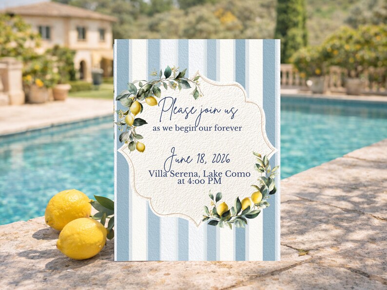 May include: Wedding invitation with a blue and white striped background. The invitation features the text "Please join us as we begin our forever" and event details. Lemons and greenery frame the text. Two lemons rest in the foreground.