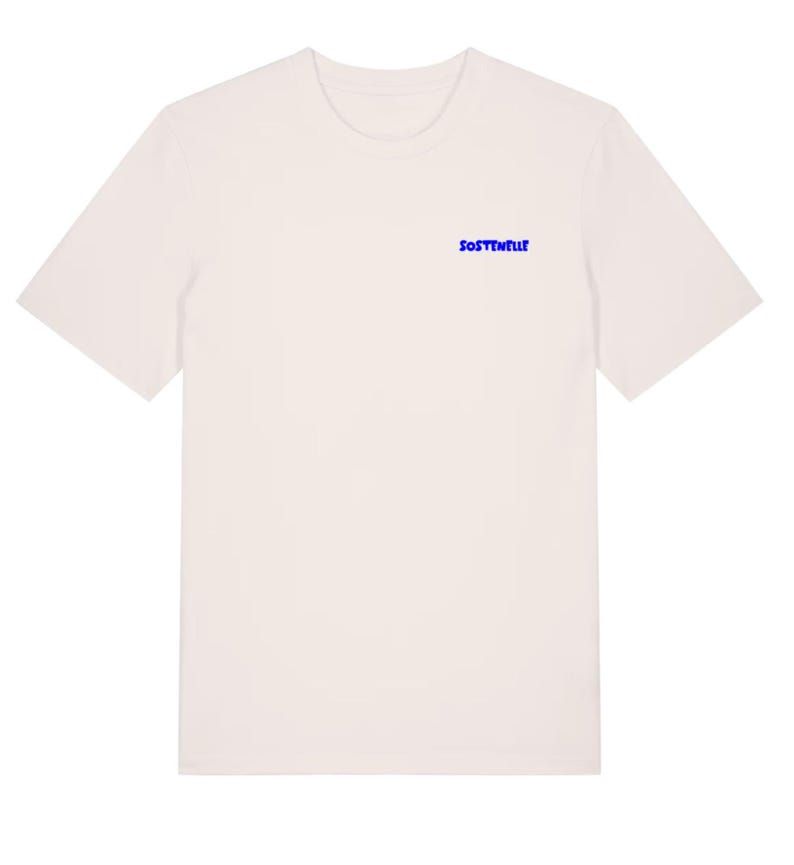 May include: Off-white t-shirt with short sleeves. The word "SOSTENELLE" is printed in blue on the upper chest area. The shirt has a crew neck and a simple, minimalist design, suitable for casual wear.