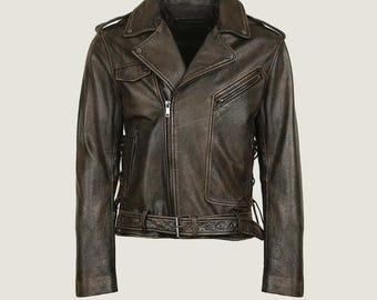 May include: A brown leather jacket with a classic biker style. Features include an asymmetrical zipper, a notched collar, multiple pockets, and a belt at the waist. The jacket has a distressed finish, giving it a vintage look.