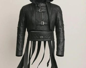 May include: Black leather hooded jacket with multiple buckles and straps. The jacket features a cropped design with a quilted belt and long, dangling straps with metal rings. The sleeves have a ribbed design.