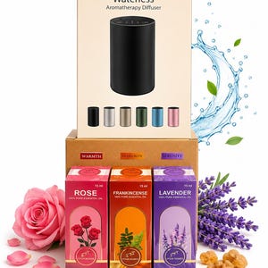 May include: A waterless aromatherapy diffuser in a beige box, accompanied by three 15 ml essential oil bottles labelled Rose, Frankincense, and Lavender. The diffuser box shows six colour options. The oil boxes feature floral and botanical imagery.