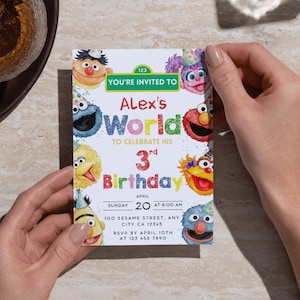 May include: A rectangular birthday invitation card featuring colorful illustrations of Sesame Street characters wearing party hats. The text reads: YOU'RE INVITED TO Alex's World TO CELEBRATE HIS 3rd Birthday, Sunday April 20 at 8:00 AM, 100 Sesame Street, Any City CA 12345, RSVP by April 10th at 123 456 7890.