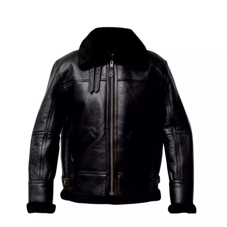 May include: A black leather jacket with a shearling collar and lining. The jacket features a zip-up front, two front pockets, and a buckled waist. The sleeves have shearling cuffs. A classic outerwear piece.