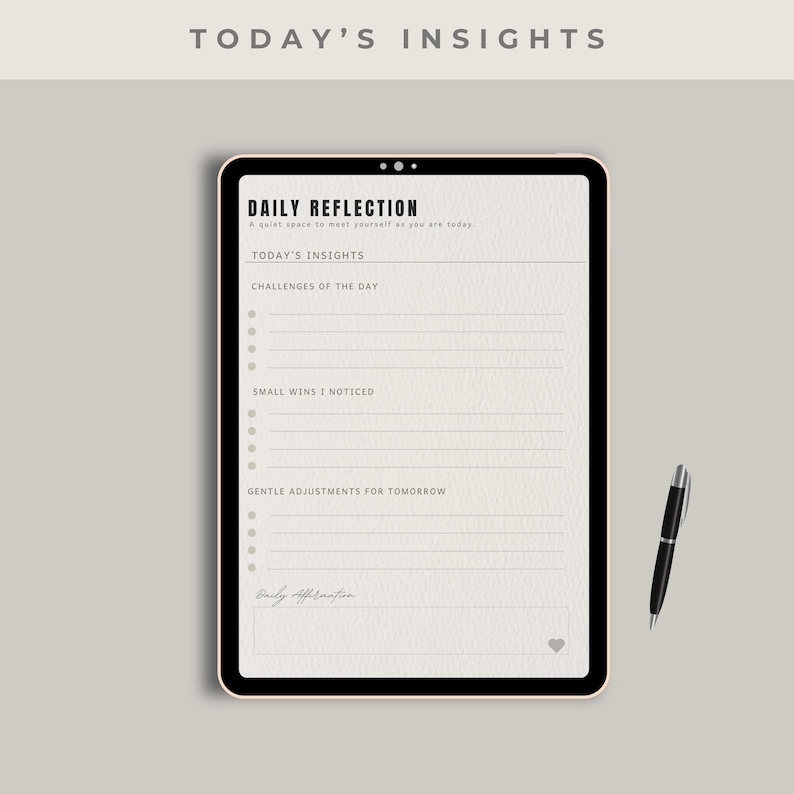May include: A digital planner with the text "Today's Insights" and "Daily Reflection." The planner includes sections for daily insights, challenges, small wins, and adjustments. A black pen rests beside the planner on a neutral background.