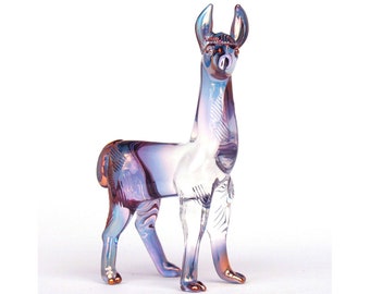 May include: A glass llama figurine with a purple and iridescent finish. The llama is standing with its head held high and its ears perked up.