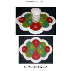 May include: A "Crazy Season Candle Mat" felt craft pattern with a finished size of 15 1/4 inches by 11 1/4 inches. The pattern features a red, green, and white design with snowflakes and a candle in the center.
