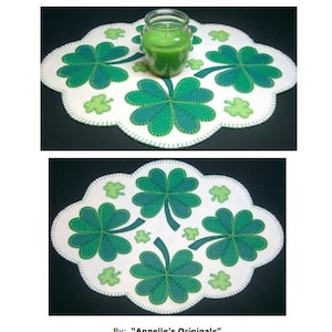 May include: A white felt candle mat with a green shamrock design. The mat is 15 inches by 11 3/4 inches and features a green candle in the center.