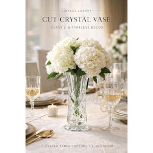 May include: A cut crystal vase, 9 inches in height, filled with white flowers, sits on a table set for a formal occasion. The vase is surrounded by wine glasses, candles, and gold-toned cutlery. Text reads "CUT CRYSTAL VASE".