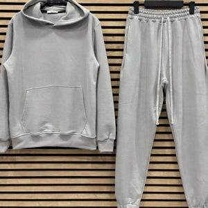 Grijze uniseks joggingbroek met capuchon – loungekleding van katoenmix