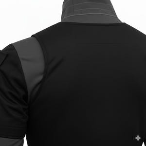 May include: Black athletic shirt with grey shoulder and neck accents. The shirt has a crew neck and short sleeves. The back of the shirt is plain black. The collar is grey with a subtle design.