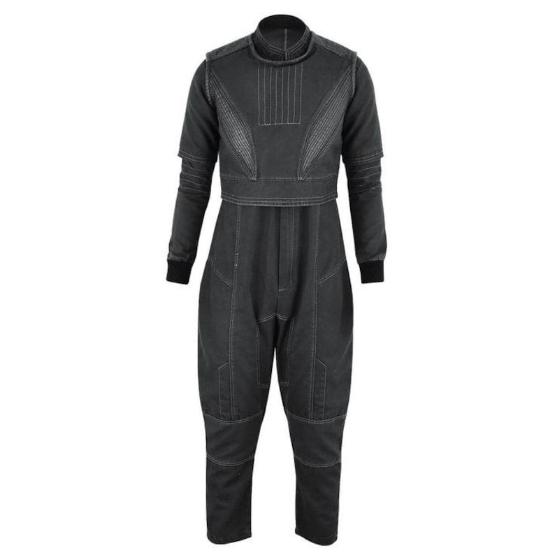 May include: A dark gray jumpsuit with a high collar and long sleeves. The garment features detailed stitching and a unique design, with a cropped top and a relaxed fit in the pants. The cuffs and collar are black.
