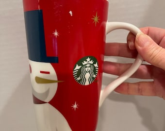 Starbucks Holiday Coffee Mug Featuring a Winking Snowman 16 oz Capacity