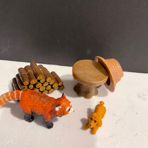 Group of Mini toys safari hat ringtail stump table poodle