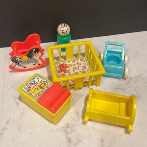 May include: A set of vintage Fisher-Price Little People toys for a nursery, including a rocking horse, crib, bassinet, stroller, and a little person figure.