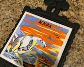 Vintage cast iron trivet with Alaska tile design ceramic center with polar bear picture