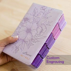 Engraved purple leather KJV Bible personalized for women featuring a custom name engraved on the cover, elegant pink indexing tabs, classic King James Version text, and a timeless Christian design, perfect as a faith-filled gift for her, baptism, or special occasion