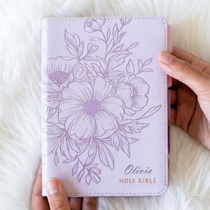 Personalized women’s KJV Holy Bible with a rich purple leather cover, custom name engraving, and pink tabs for easy reference, designed as a meaningful Christian gift for women, ideal for prayer, Bible study, church, or devotional time
