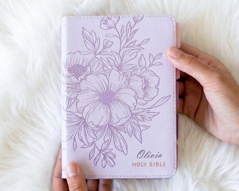 Personalized women’s KJV Holy Bible with a rich purple leather cover, custom name engraving, and pink tabs for easy reference, designed as a meaningful Christian gift for women, ideal for prayer, Bible study, church, or devotional time