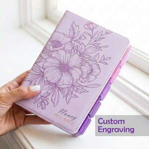 Custom engraved KJV Bible for women showcasing a soft purple leather binding, personalized name on the front cover, coordinating pink tabs, and traditional King James Version scripture, making a beautiful Christian keepsake gift for her faith journey