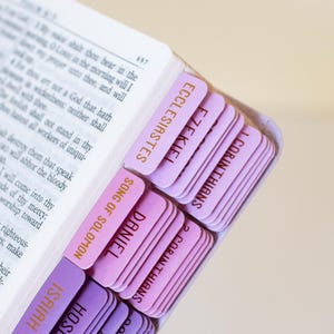 Personalized women’s KJV Holy Bible with a rich purple leather cover, custom name engraving, and pink tabs for easy reference, designed as a meaningful Christian gift for women, ideal for prayer, Bible study, church, or devotional time