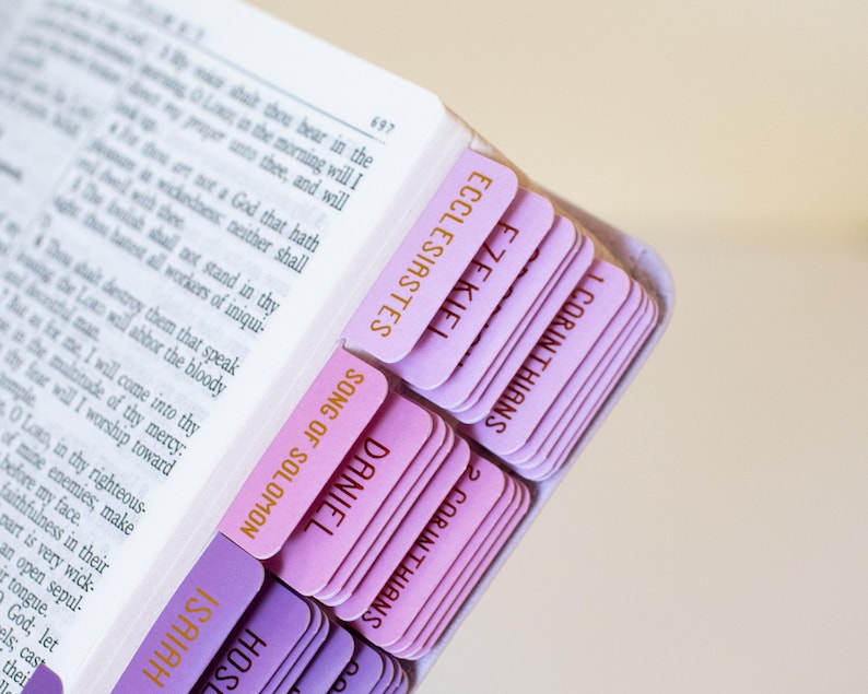 Personalized women’s KJV Holy Bible with a rich purple leather cover, custom name engraving, and pink tabs for easy reference, designed as a meaningful Christian gift for women, ideal for prayer, Bible study, church, or devotional time