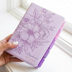 Engraved purple leather KJV Bible personalized for women featuring a custom name engraved on the cover, elegant pink indexing tabs, classic King James Version text, and a timeless Christian design, perfect as a faith-filled gift for her, baptism, or special occasion