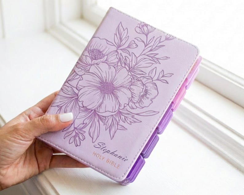 Engraved purple leather KJV Bible personalized for women featuring a custom name engraved on the cover, elegant pink indexing tabs, classic King James Version text, and a timeless Christian design, perfect as a faith-filled gift for her, baptism, or special occasion