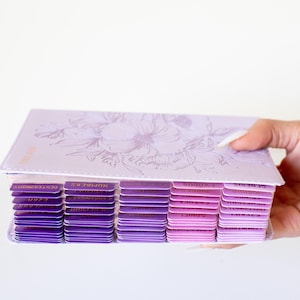 Personalized women’s KJV Holy Bible with a rich purple leather cover, custom name engraving, and pink tabs for easy reference, designed as a meaningful Christian gift for women, ideal for prayer, Bible study, church, or devotional time