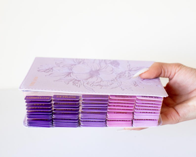 Personalized women’s KJV Holy Bible with a rich purple leather cover, custom name engraving, and pink tabs for easy reference, designed as a meaningful Christian gift for women, ideal for prayer, Bible study, church, or devotional time