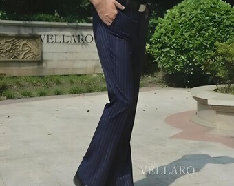 May include: Navy blue pinstripe trousers with a classic fit. The trousers feature vertical white stripes and a tailored design. The image shows the trousers with a black belt and shoes. The word "VELLARO" is visible in the image.