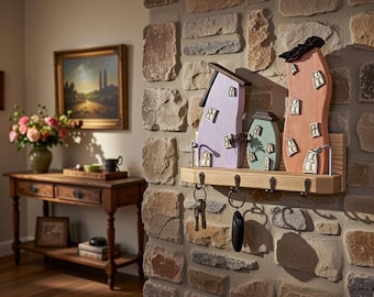 A Wooden Key Holder Decorated With Colorful Little Houses