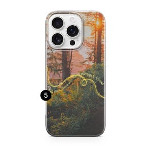 May include: A clear phone case featuring a scenic forest landscape with a sunset. The design includes the text "invisible string" and "all along there was some" in a yellow, curved font. The case has a camera cutout.