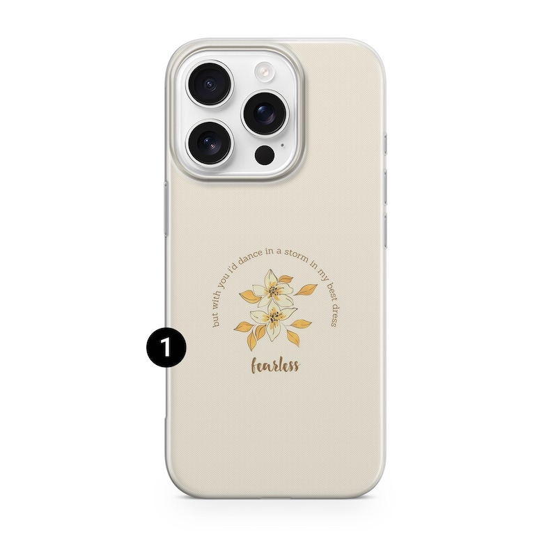 May include: A cream-colored phone case with a floral design and the word "fearless" in a script font. The case features a quote that reads, "but with you I'd dance in a storm in my best dress."