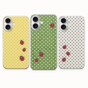 May include: Three phone cases with ladybug designs. The cases feature a yellow, green, and white background with black polka dots. Each case has a different arrangement of red ladybug illustrations.