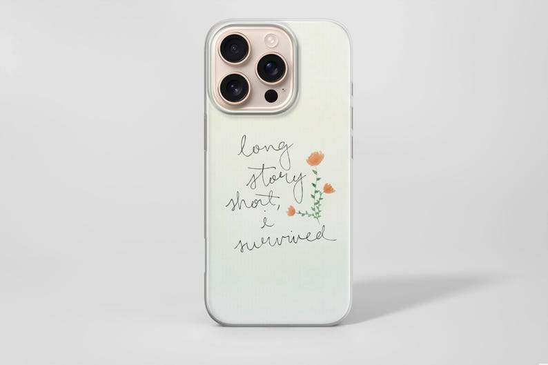 May include: A phone case with a clear border and a soft gradient background. The case features the handwritten text "long story short, I survived" with a small floral illustration in orange and green.