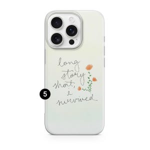 May include: A white phone case with a gradient background and the text "long story short, I survived" in cursive. The case features a floral design with orange flowers and green stems.