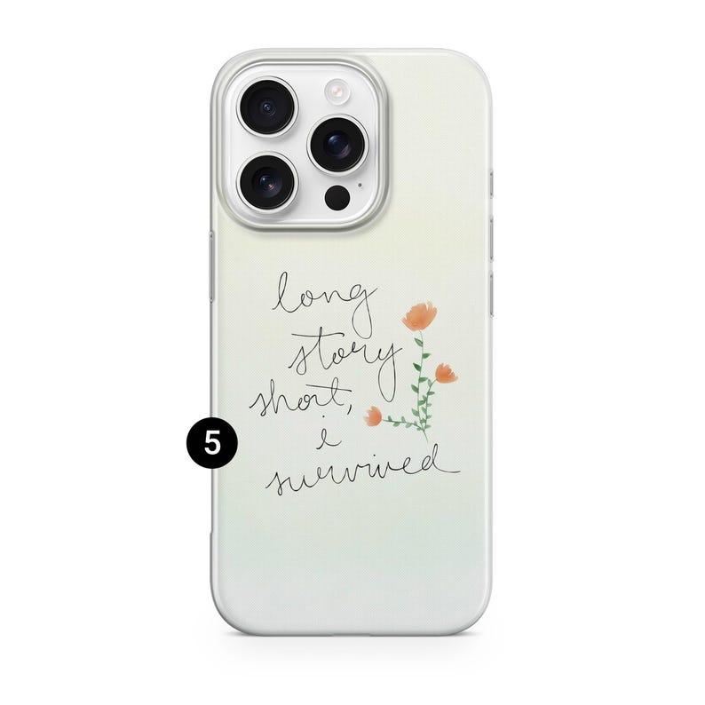 May include: A white phone case with a gradient background and the text "long story short, I survived" in cursive. The case features a floral design with orange flowers and green stems.