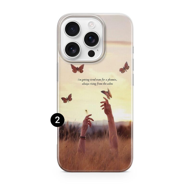 May include: A phone case featuring a sunset scene with butterflies and the text "I'm getting tired even for a phoenix, always rising from the ashes." The case has a clear border and a design of hands reaching up.