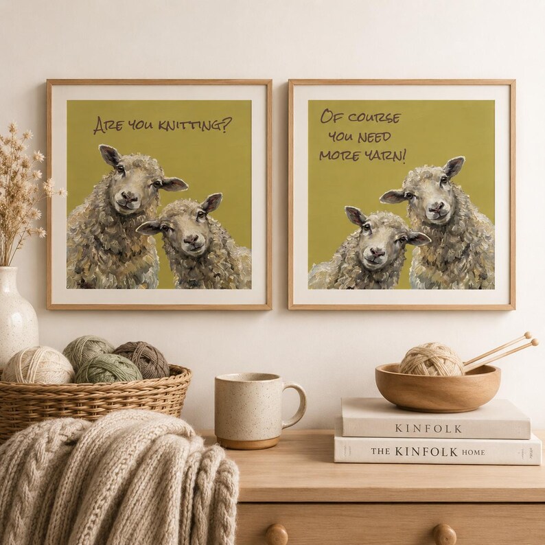 May include: Two square framed wall art prints with light wood frames. The left print shows two sheep on a mustard background with the text Are you knitting? The right print shows two sheep on a mustard background with the text Of course you need more yarn!
