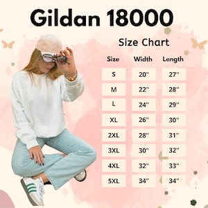 May include: A Gildan 18000 size chart with measurements in inches. The chart lists sizes S through 5XL, with corresponding width and length measurements. The image also features a person wearing a white sweatshirt and light blue jeans.