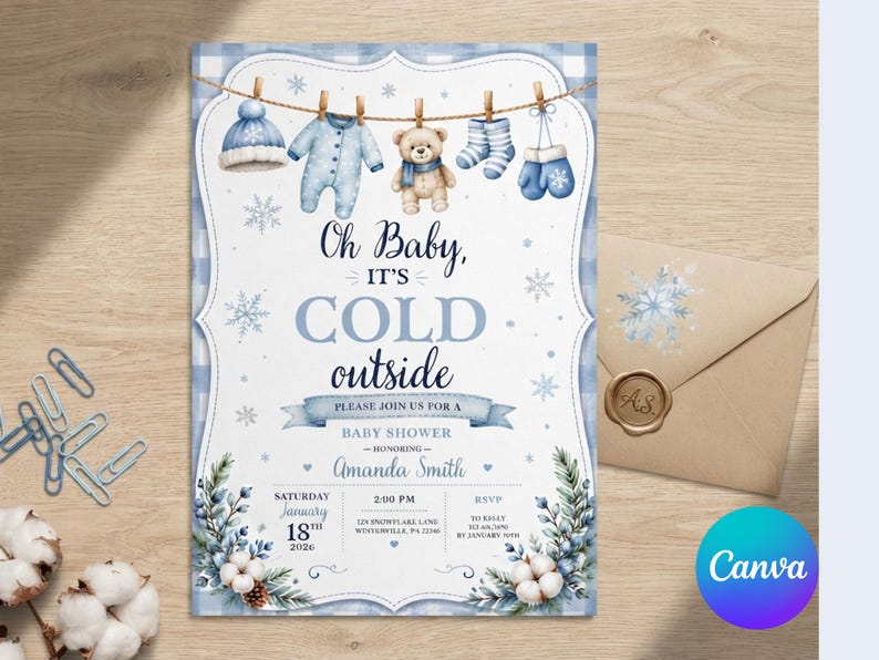 May include: A baby shower invitation card featuring a blue and white buffalo check border, a clothesline with a hat, onesie, teddy bear, socks, and mittens, and the text Oh Baby, it's COLD outside, Amanda Smith, January 18, 2020, and event details.