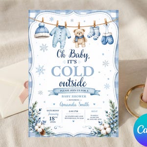 May include: A baby shower invitation card featuring a blue plaid border, a clothesline with a hat, onesie, teddy bear, socks, and mittens, and the text Oh Baby, IT'S COLD outside. The card includes event details for Amanda Smith on January 18, 2026.